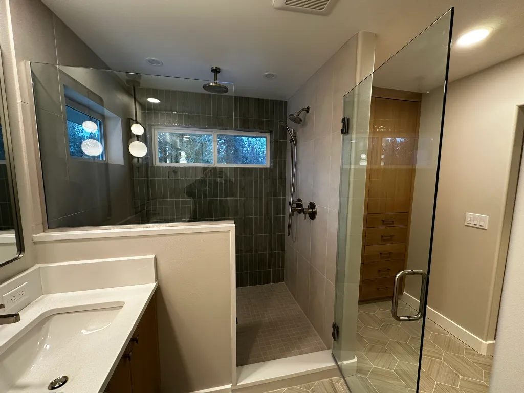 Custom tiled master shower built by Purple Rain Construction