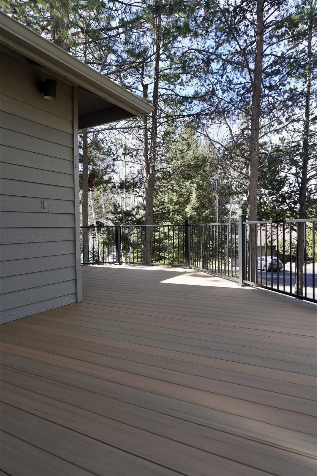 Engineered and permitted Sunriver deck rebuild - composite decking with black rail